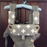 Grey and white swiss cross Ergobaby 360 sucking pads for dribbling babies
